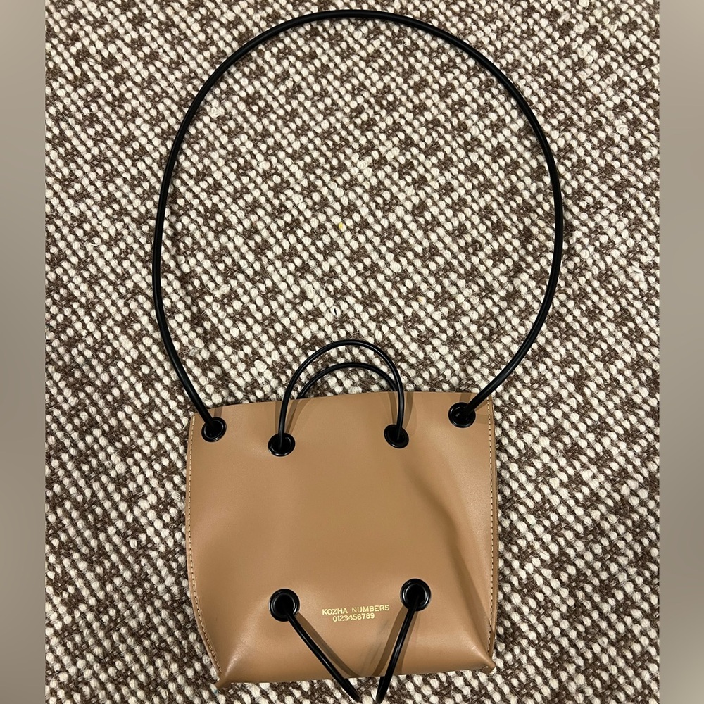 Kozha Numbers Tan Crossbody Drawstring Bag